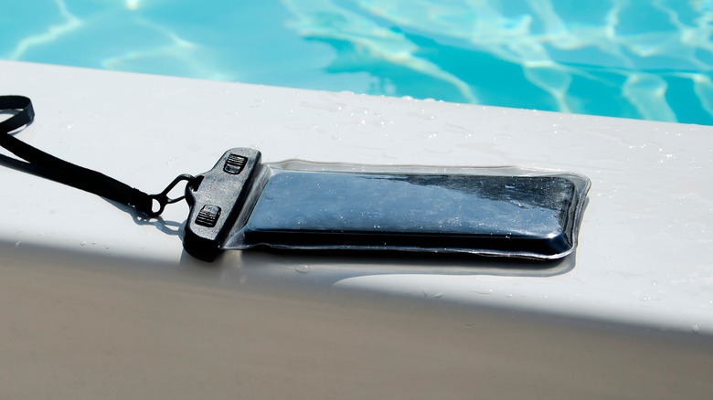 Android Phone in a waterproof pouch near a swimming pool