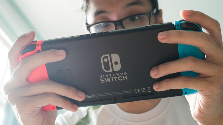 Boy playing Nintendo Switch