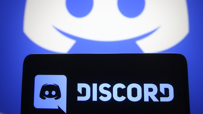 Discord logo on phone and background